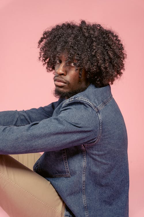 Black man in casual wear in studio