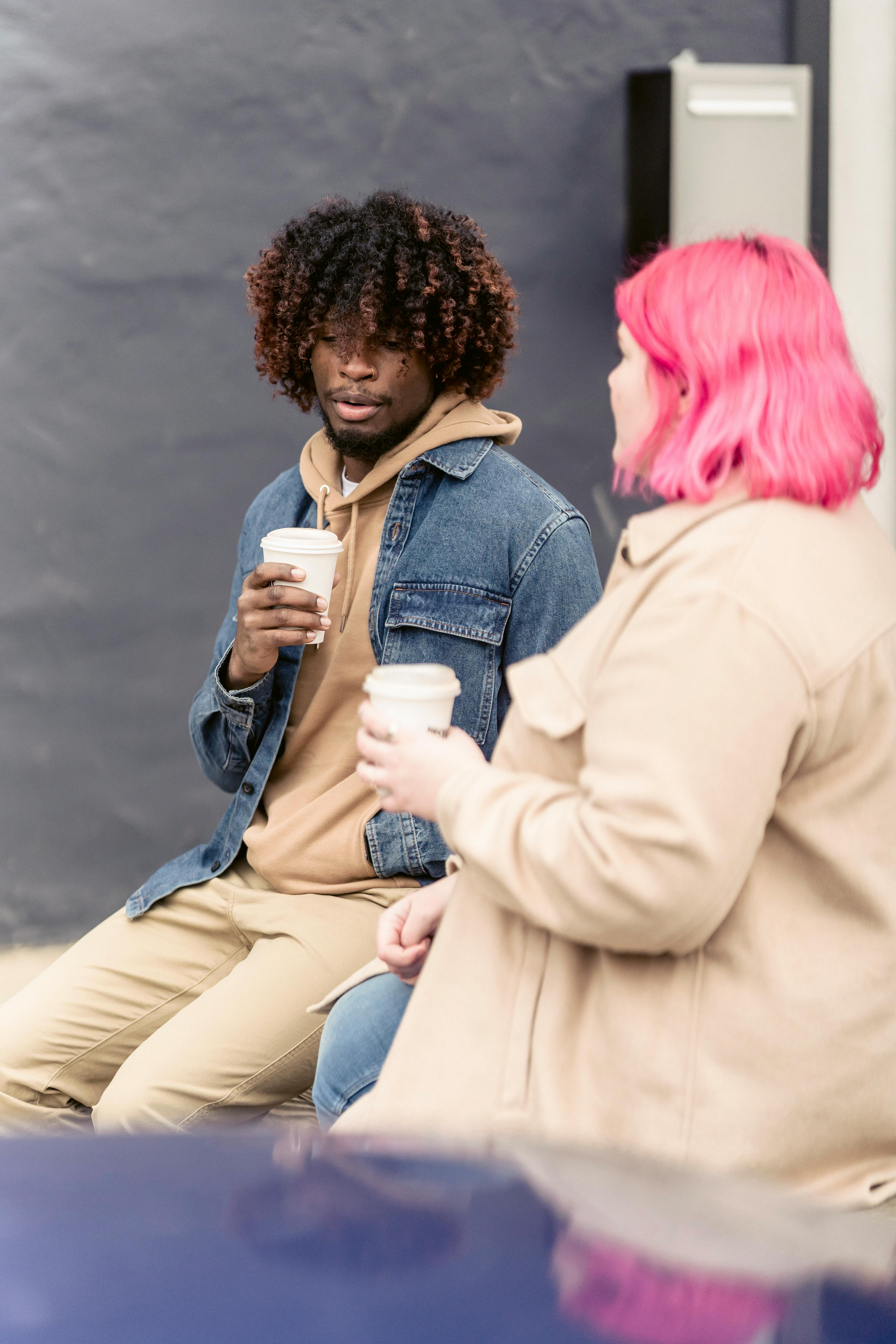 diverse couple with takeaway coffee