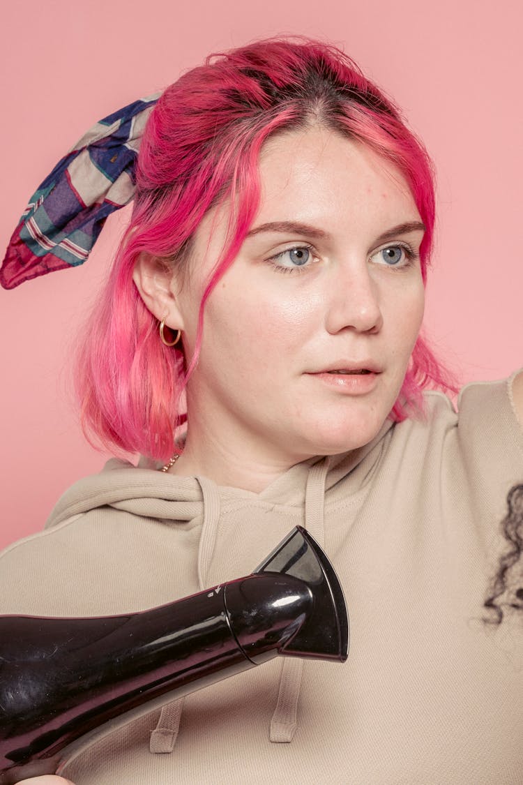 Stylish Woman With Pink Hair And Hair Dryer