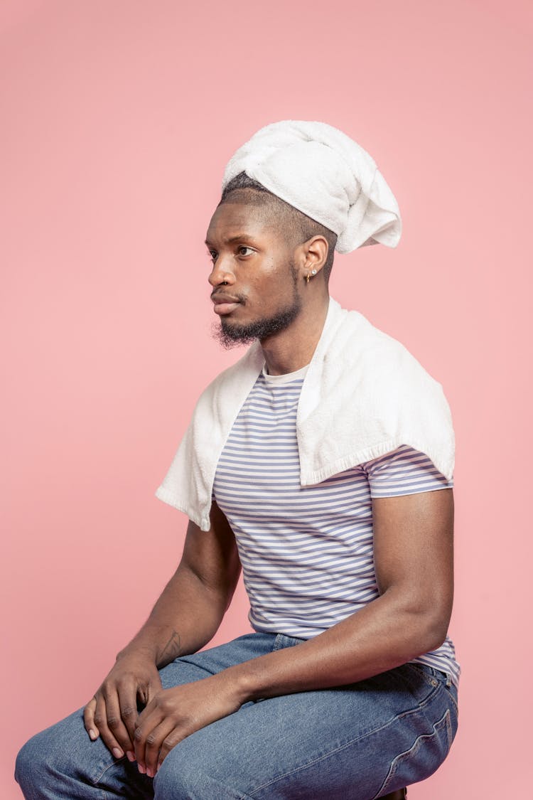 Black Man Drying Hair With Towel On Head