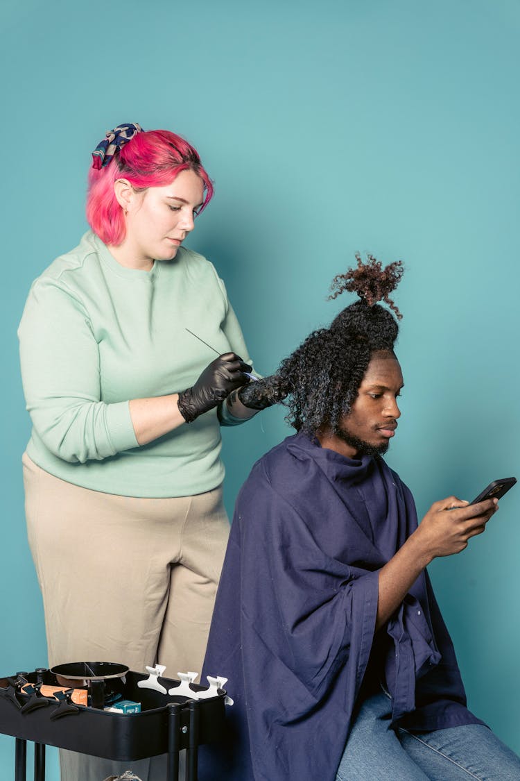 Hairdresser Coloring Hair Of Black Client