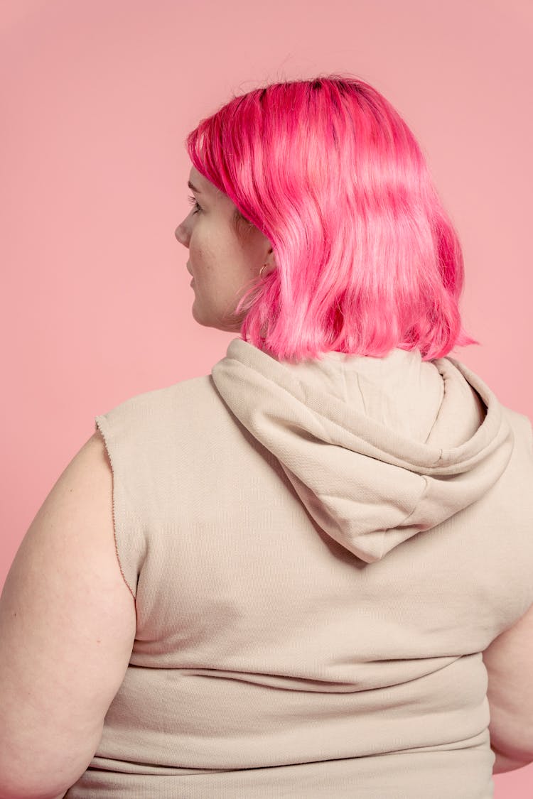 Back View Of A Young Woman With Pink Hair 