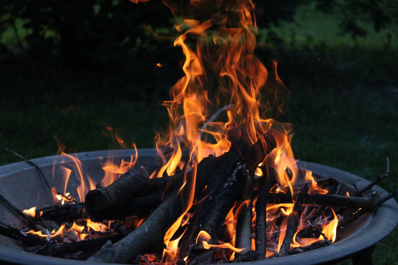 festive-fire-pit-seating Flames burning in an outdoor fire pit