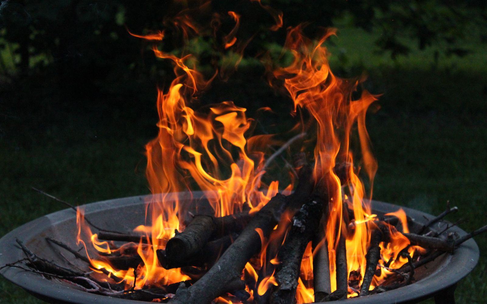 Close-up of a vibrant fire burning in an outdoor fire pit