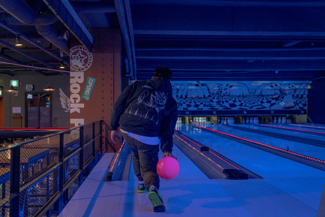 Free Back View of a Man Playing Bowling Stock Photo