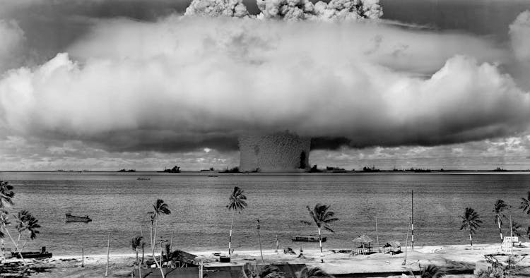 Grayscale Photo Of Explosion On The Beach