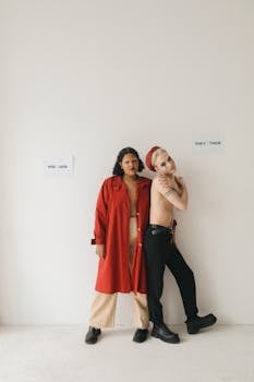 Two people showcasing gender identity with inclusive pronouns on a white background.