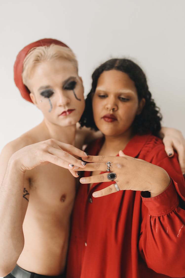 Eccentric Couple Posing On White Background