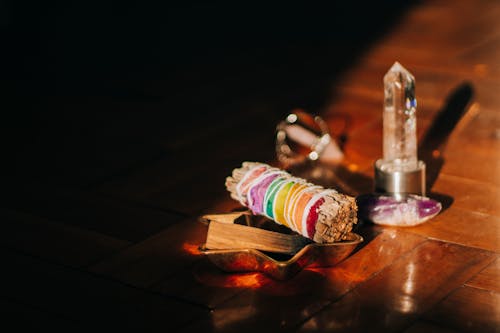 Collection of smudge sticks on wooden floor