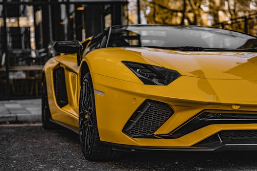 Close-up of a yellow Lamborghini Aventador parked outdoors in Edinburgh, showcasing luxury and performance.