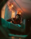 Man sitting on couch in room