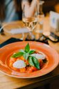 Sliced Tomato on Orange Plate