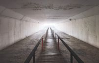 Brown Wooden Bridge on White Tunnel