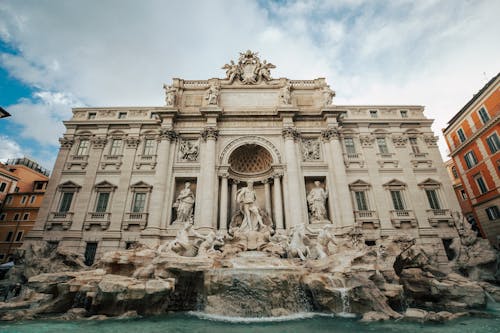 Trevi Fountain Under White Clouds