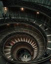 People Walking on Spiral Staircase