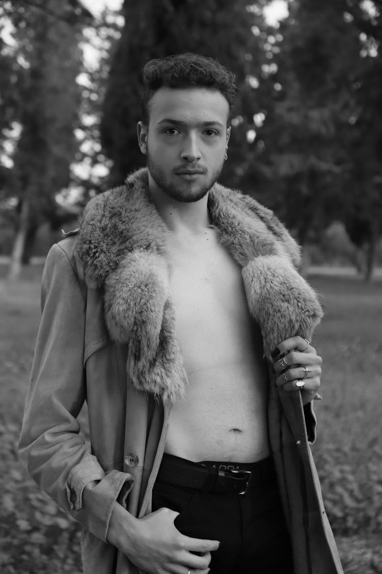 Shirtless Man Posing Wearing A Coat With Fur 