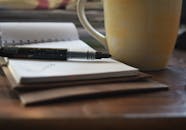 Close-Up Shot of Sign Pen on a Notepad