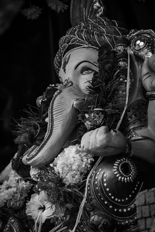 Grayscale  Photo of Ganesha Decorated with Flowers
