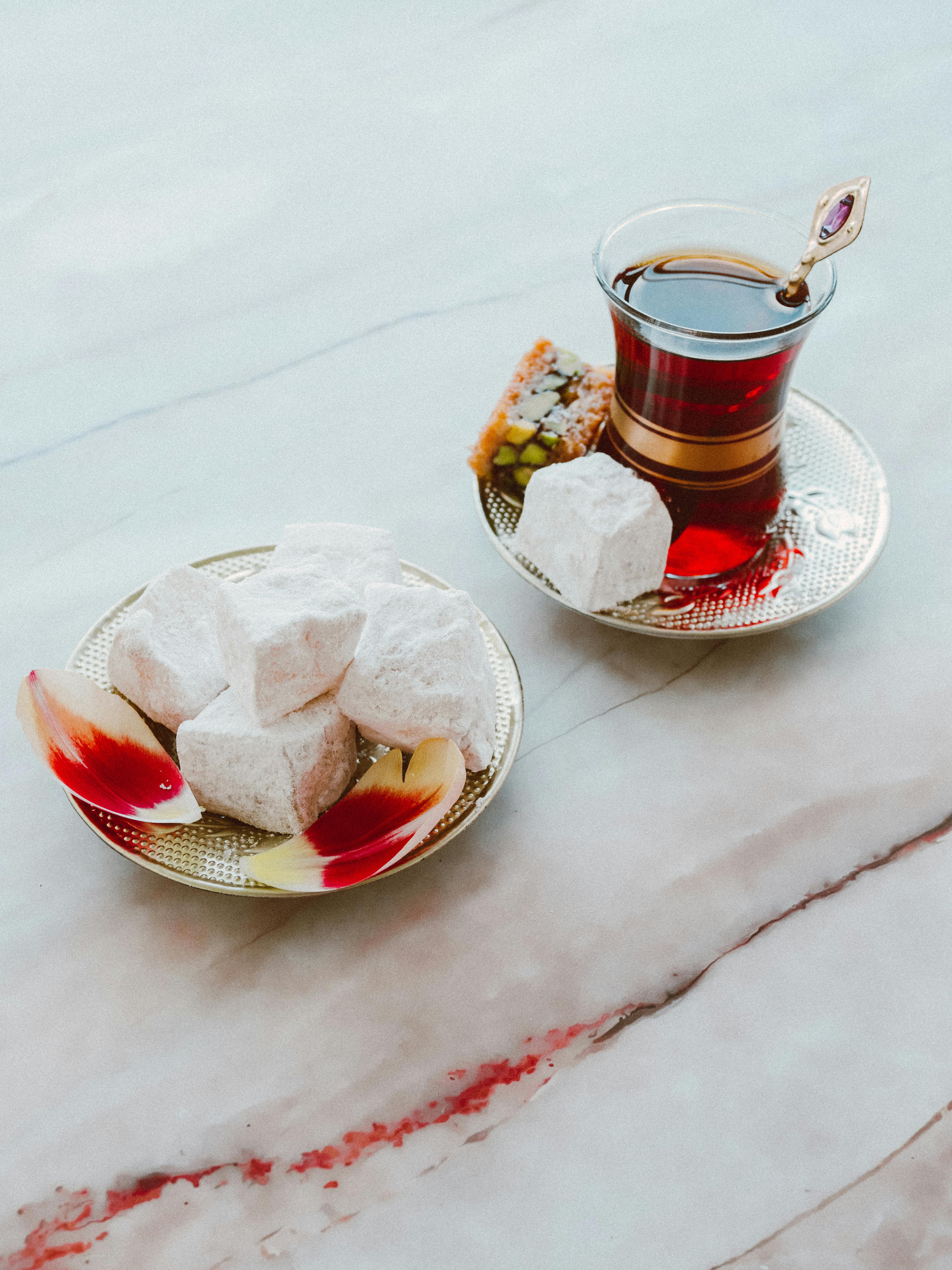 Turkish delight and tea served elegantly on decorative saucers with a blissful ambiance.