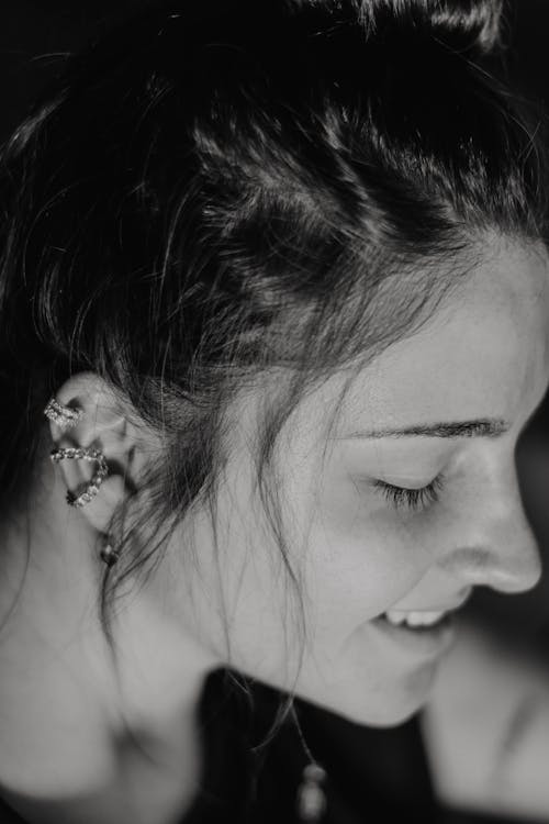 Free Black and White Photograph of a Woman with Earrings Stock Photo