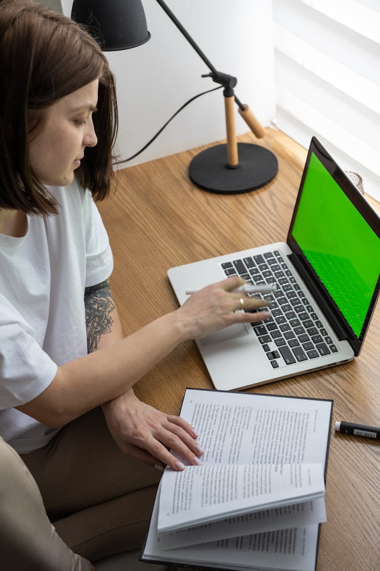 Young Female Freelancer Working Online On Laptop From Home