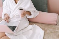 Woman in White Robe Holding White Ceramic Mug