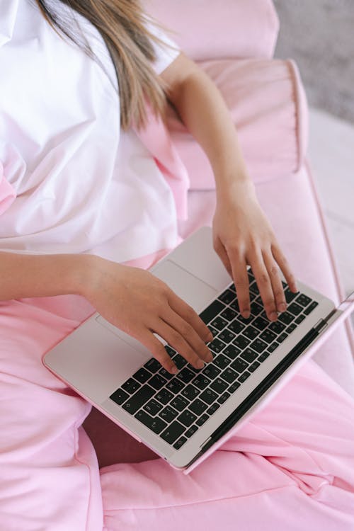 Free A Person Typing on Laptop Stock Photo