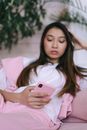 Woman in Pink Long Sleeve Shirt Holding Iphone