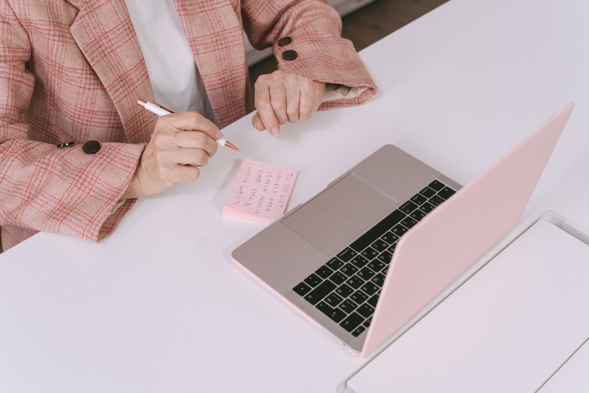 Content editor reviewing blog pages and notes before pruning old posts