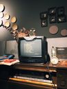 Black Crt Tv on Brown Wooden Table