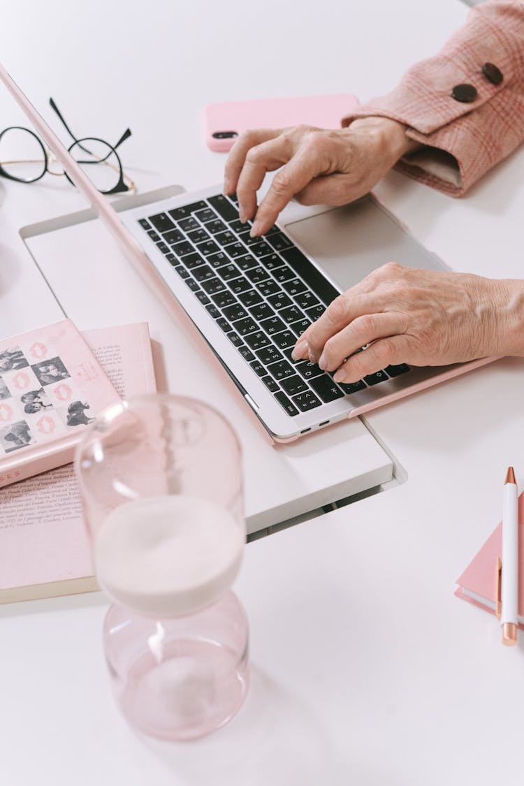 Person Using A Laptop On Table