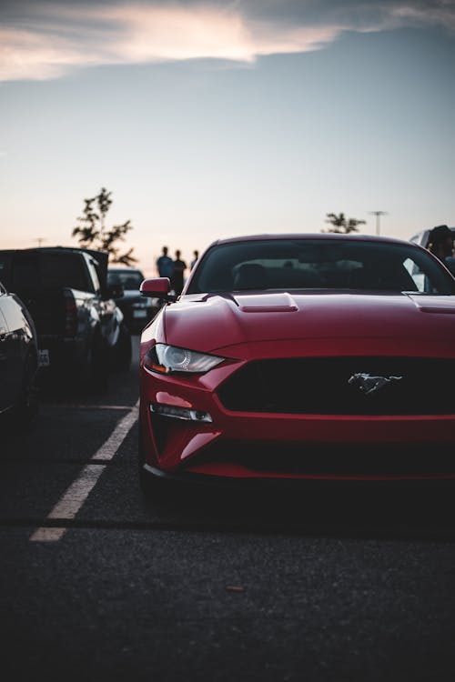 Red Mustang Parked on a Parking Lot