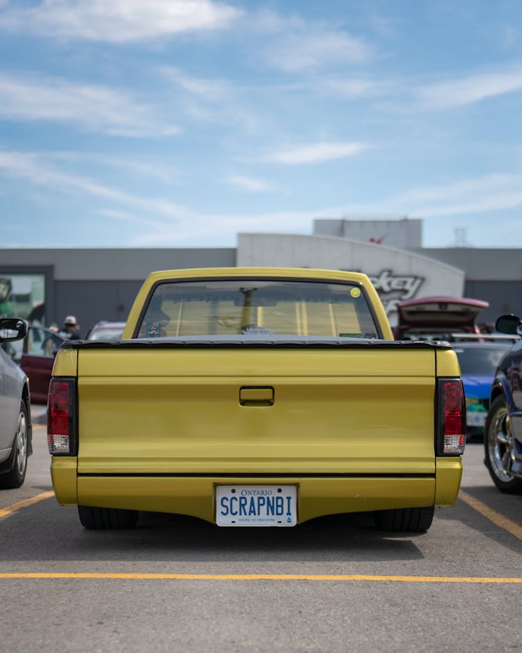 A Pickup Truck In The Parking Lot