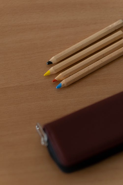 Free Colored Pencils on Wooden Surface  Stock Photo