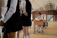 Woman in Black Skirt Standing on Brown Wooden Floor