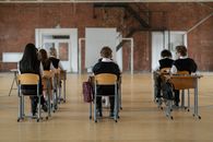 People Sitting on Chair Inside Room