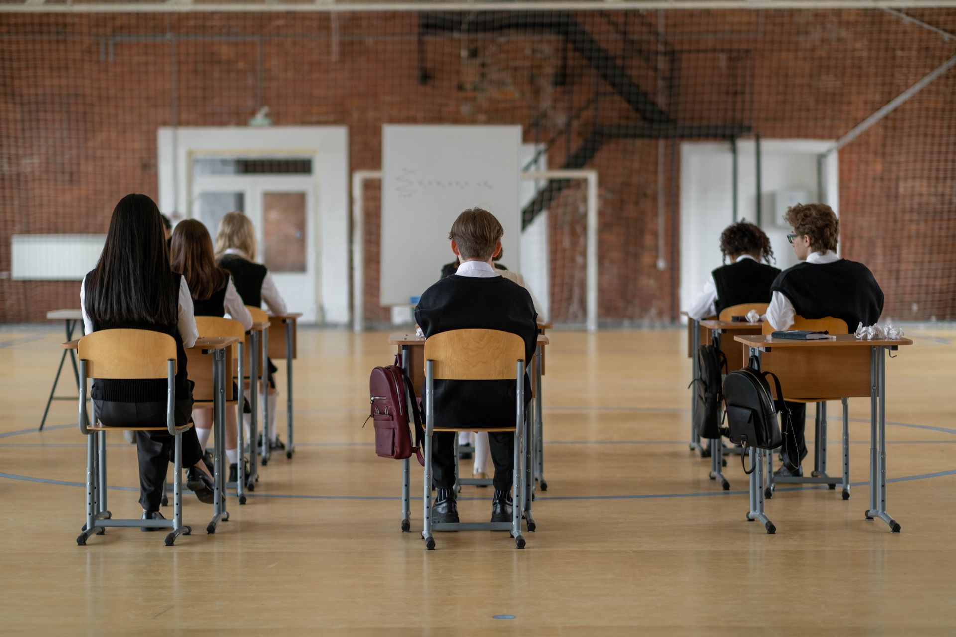 Back View of the Students Sitting Inside the Classroom