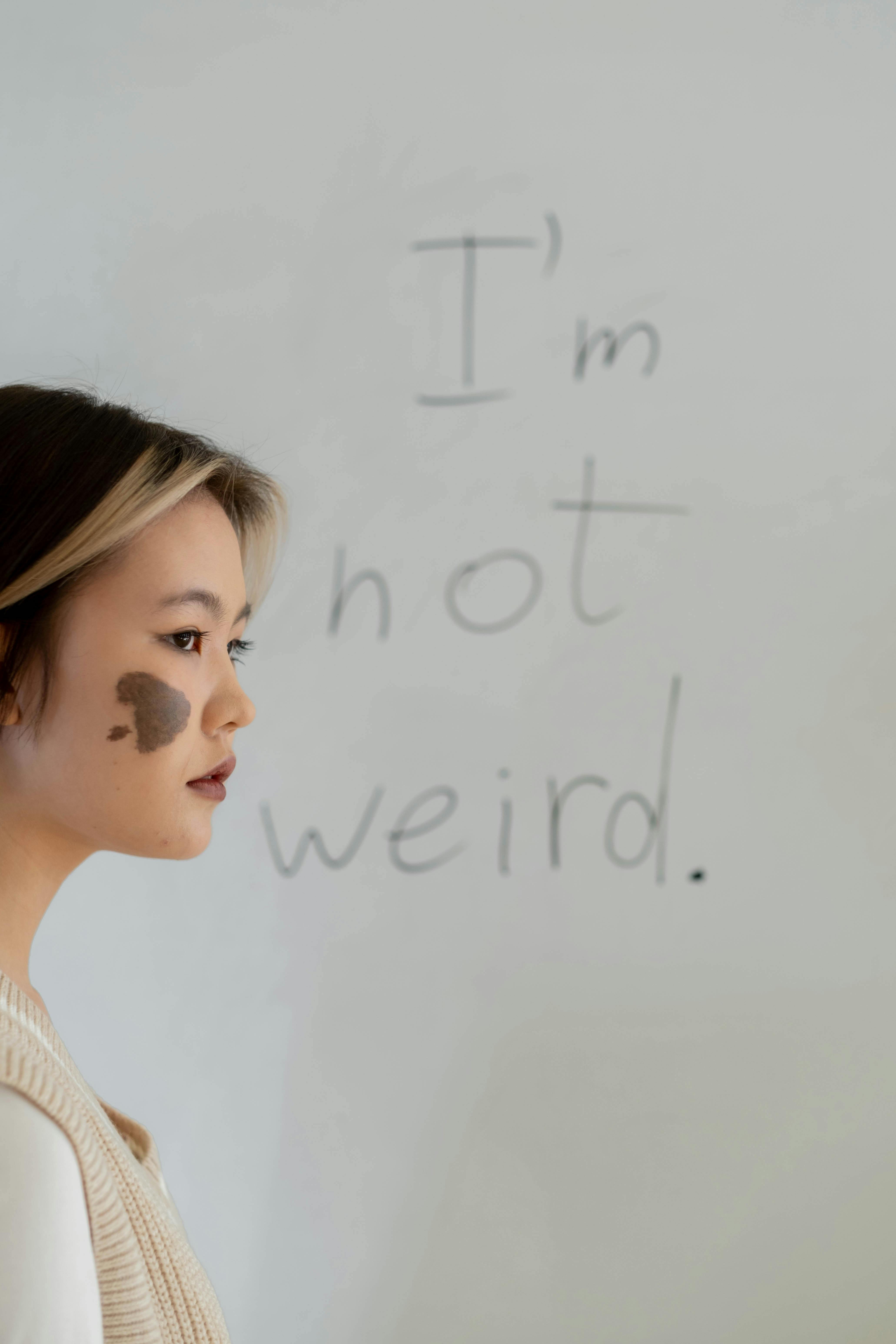 a woman standing near the whiteboard