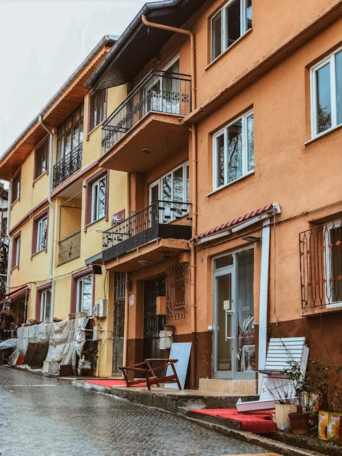 An Apartment Buildings with Balconies Near the Street