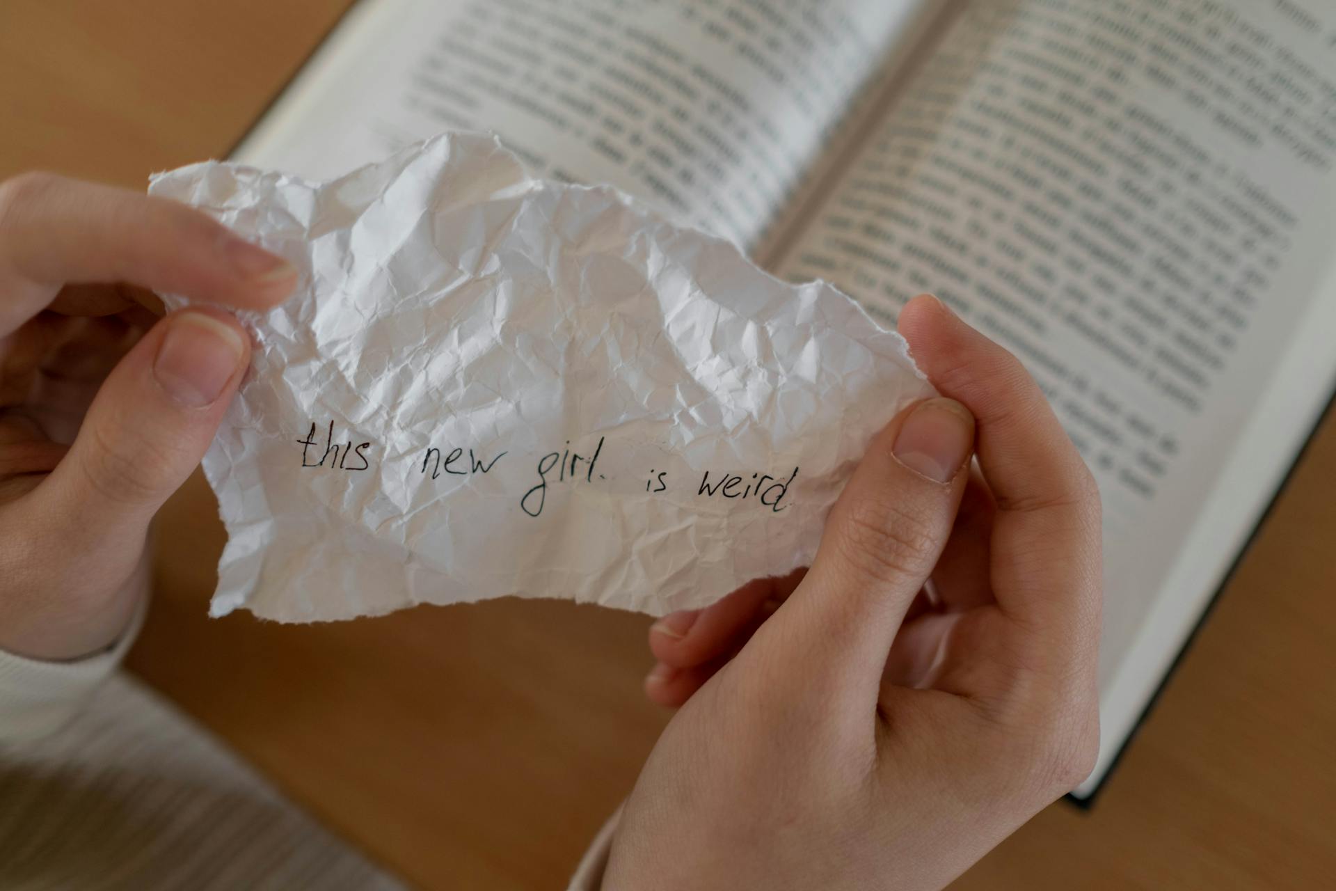 A Person Holding a Handwritten Message
