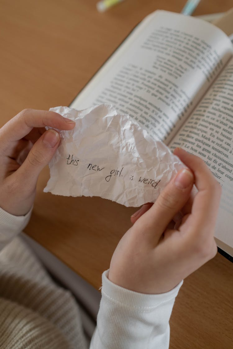 Person Holding White Crumpled Piece Of Paper