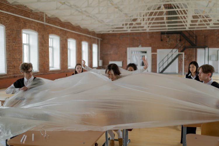 A Woman Breaking Out From A Plastic 