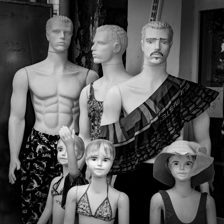 Dummies Of Men And Children In Swimwear In Store