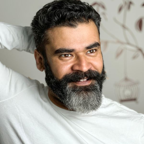 Portrait standing in for Malik Brennan, photo by Nishant Aneja on Pexels