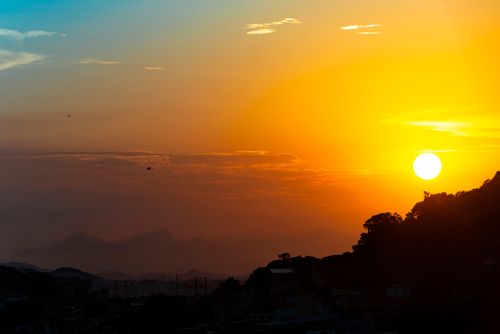 Free Silhouette of Rio de Janeiro skyline against a vivid sunset sky. Stock Photo
