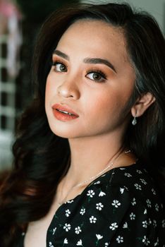 A captivating portrait of a woman with striking features, showcasing elegance and natural beauty.