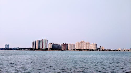 Free City Skyline Across Body of Water Stock Photo