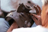 A Person Making a Creepy Mask Made of  Clay