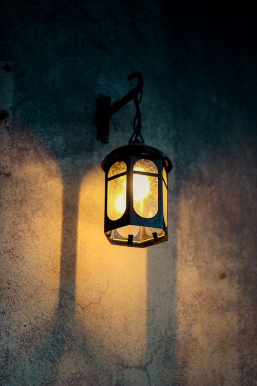 Close-Up Shot of a Lamp Hanging on a Wall