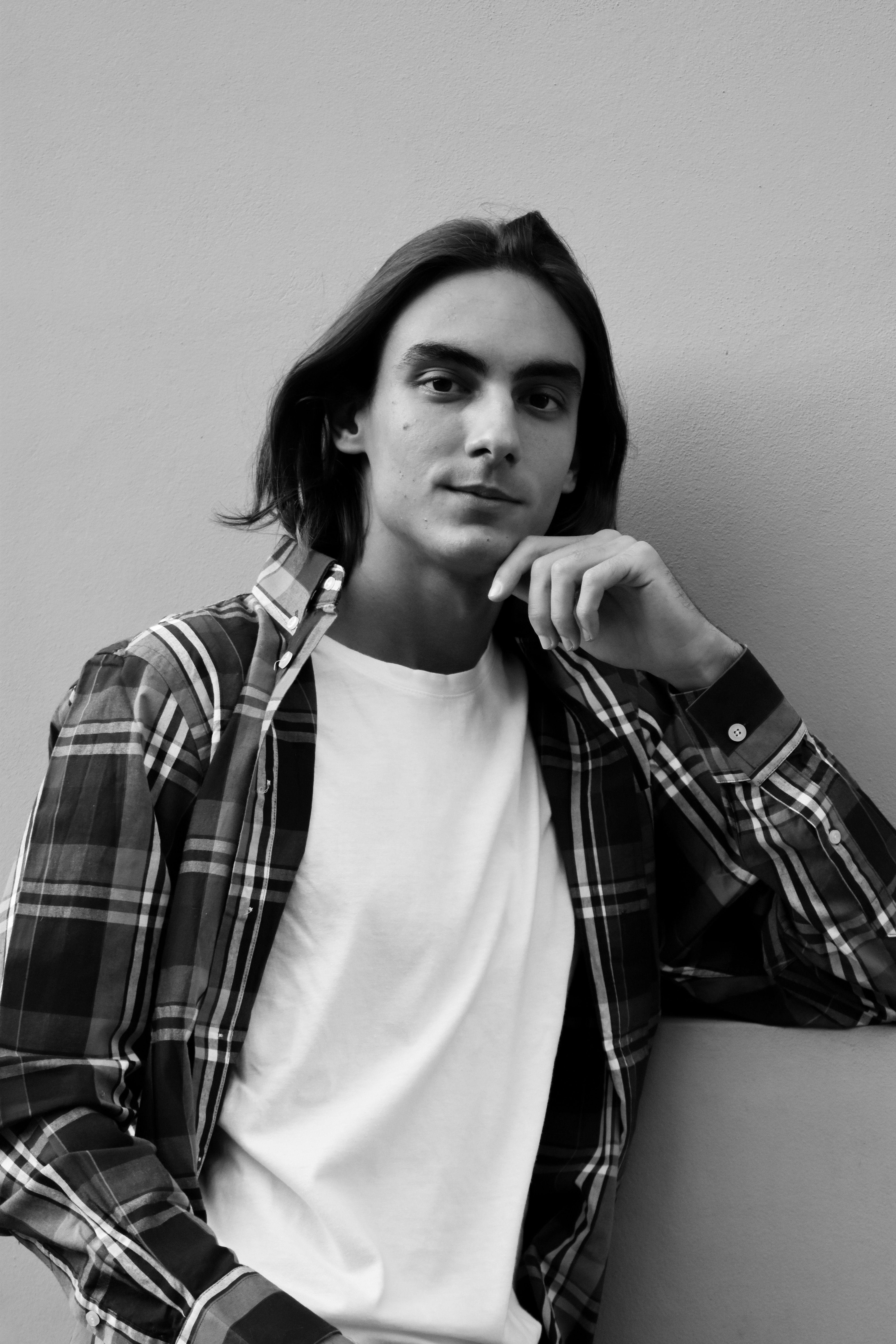 Grayscale Photo of a Person with His Hand on His Chin · Free Stock Photo